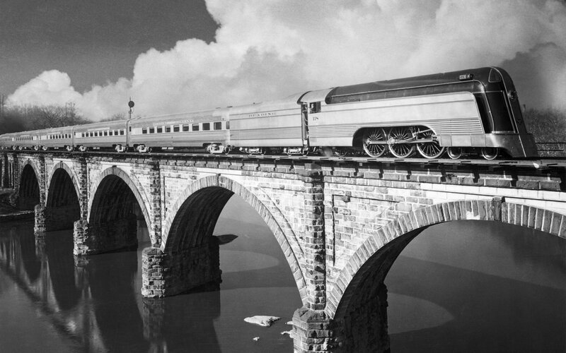 Train on a stone bridge