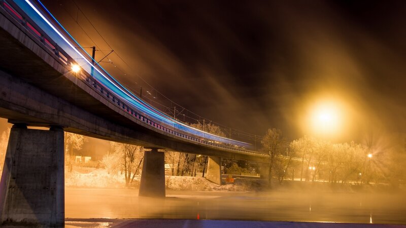 Train on Bridge at Night — Blue