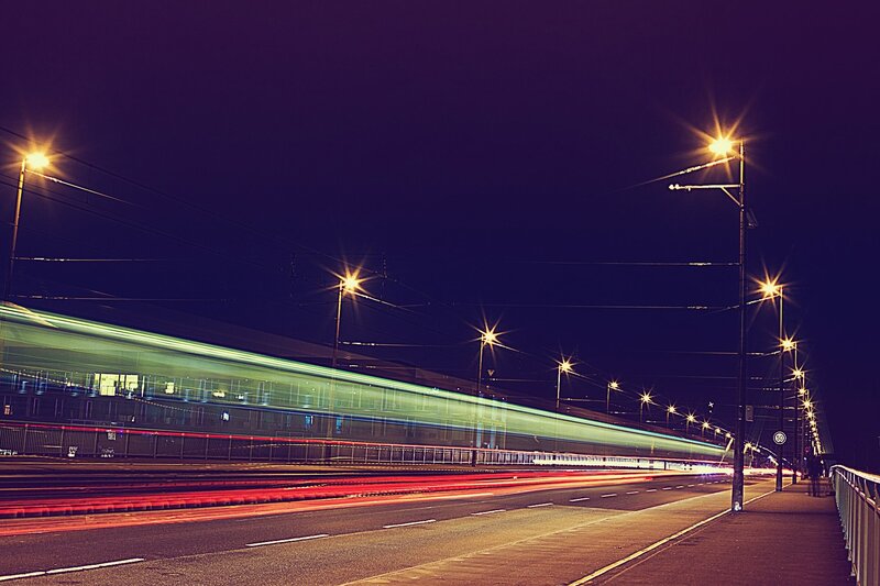 Train on Bridge at Night — Purple