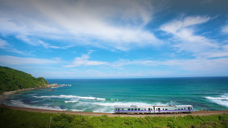 Train on Coastal Track — Blue, Serene