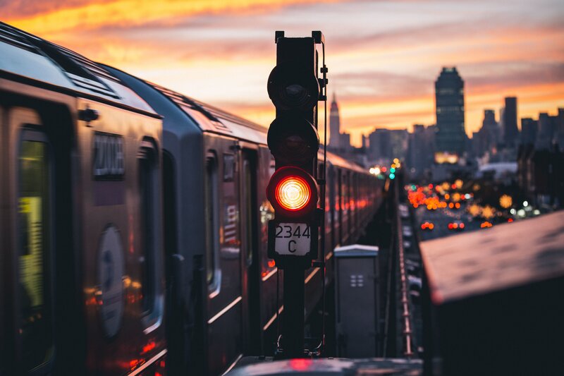 Train on Elevated Track — Orange, Dramatic