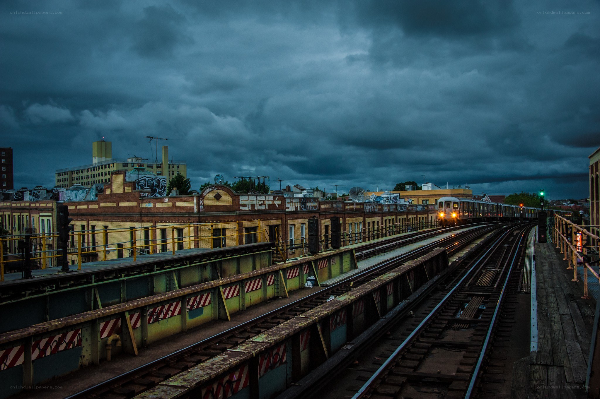 Train on elevated tracks at dusk