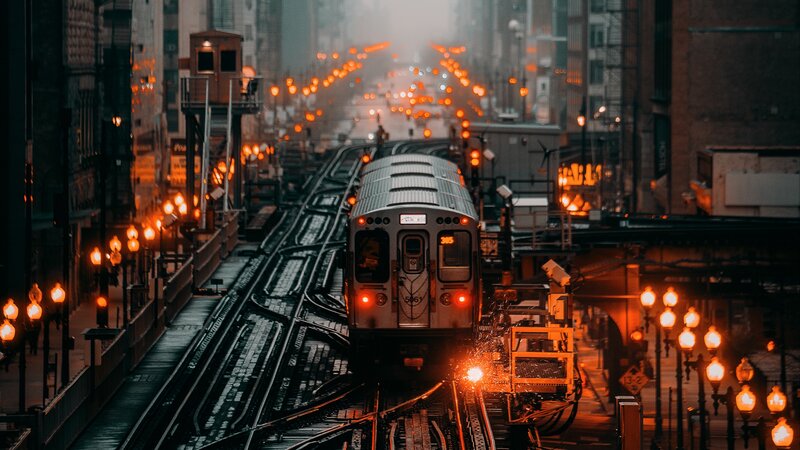 Train on Elevated Tracks — Orange, Dramatic
