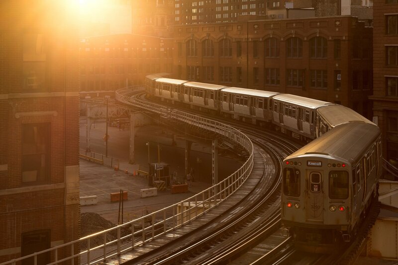 Train on Elevated Tracks — Orange