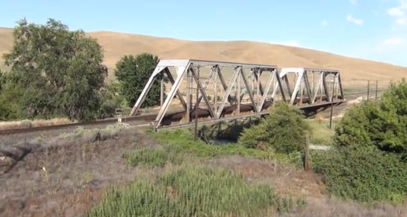 Train on Metal Bridge