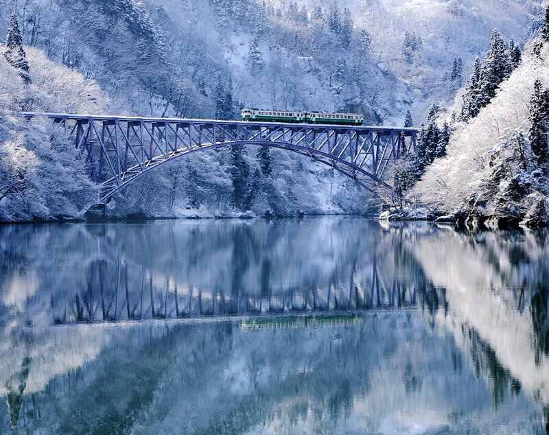 Train on Snow-covered Bridge