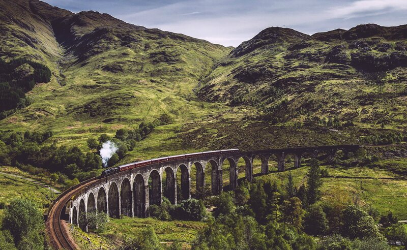 Train on Stone Viaduct — Green, Serene