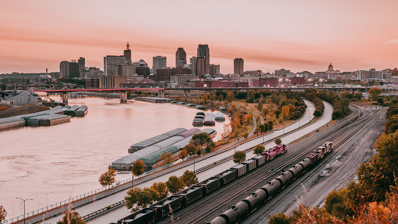 Train on Tracks by River