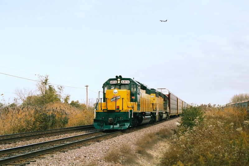 Train on tracks with airplane