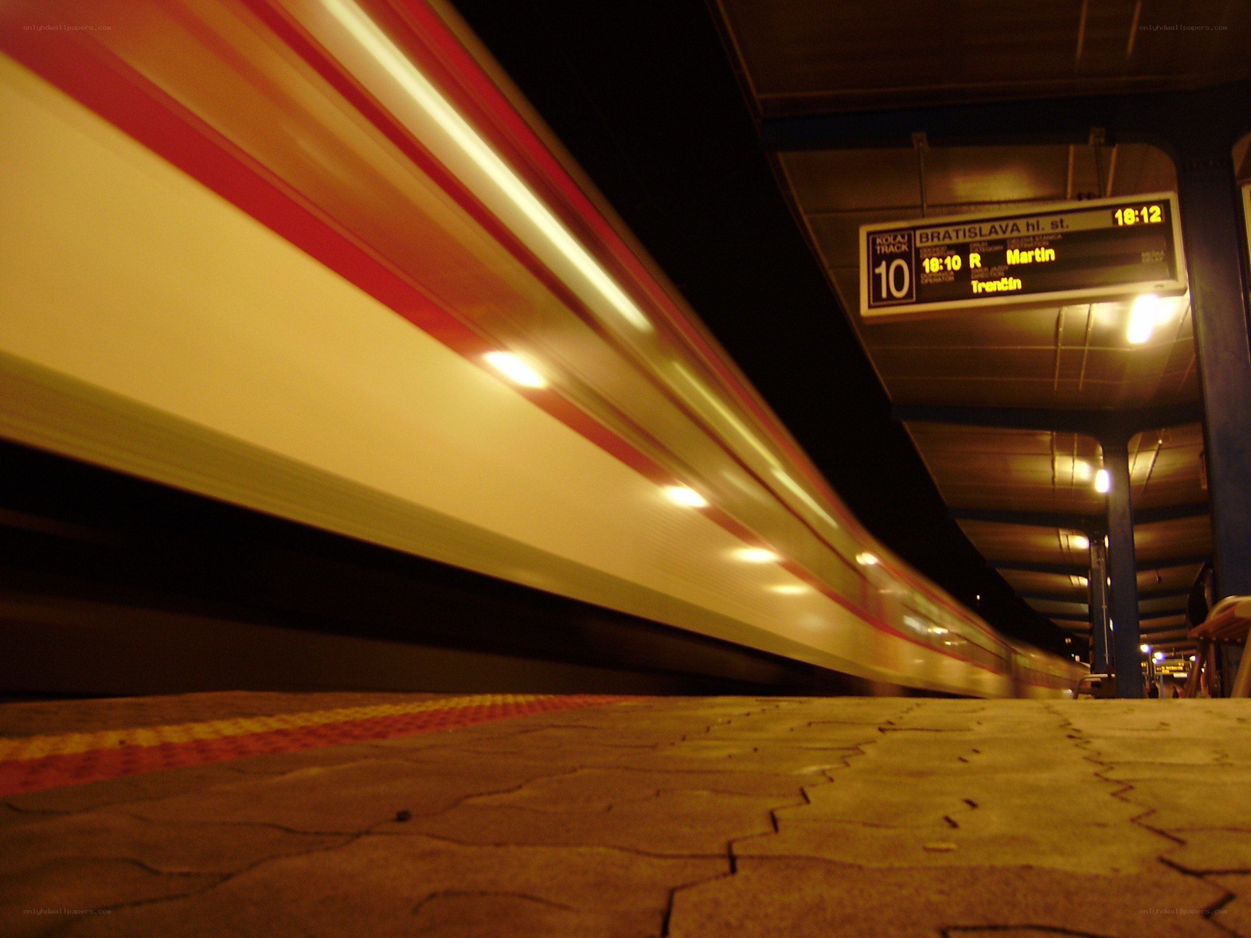 Train passing at night station