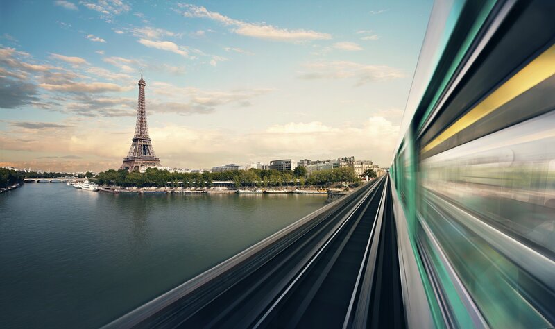 Train Passing Eiffel Tower — Blue
