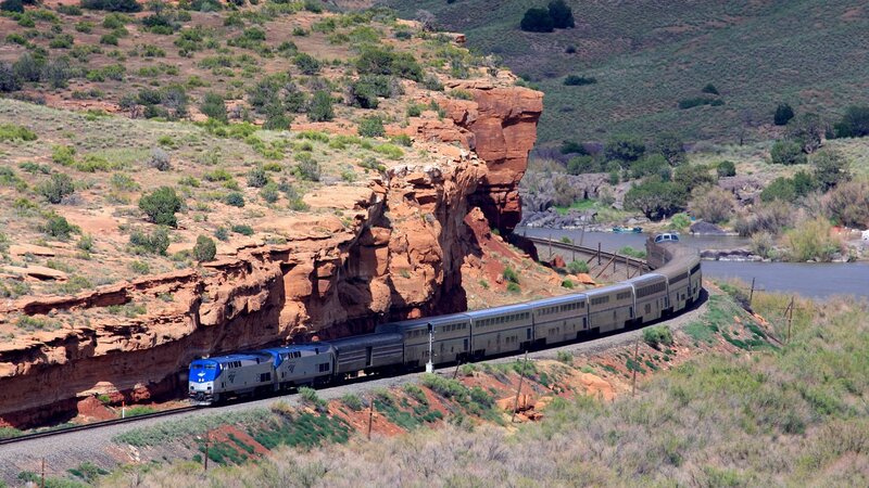 Train passing through canyon