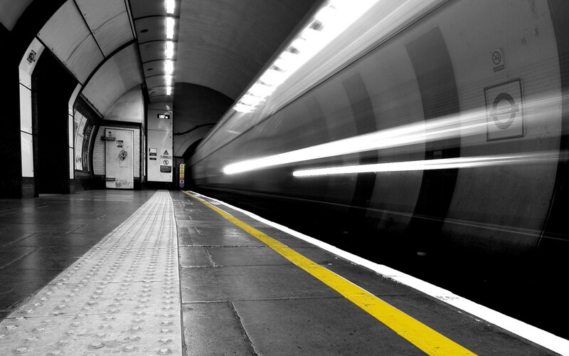 Train passing through subway station