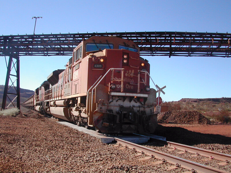 Train passing under a bridge