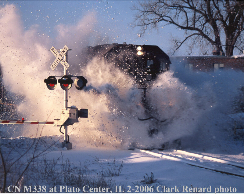Train Plowing Through Snow — White