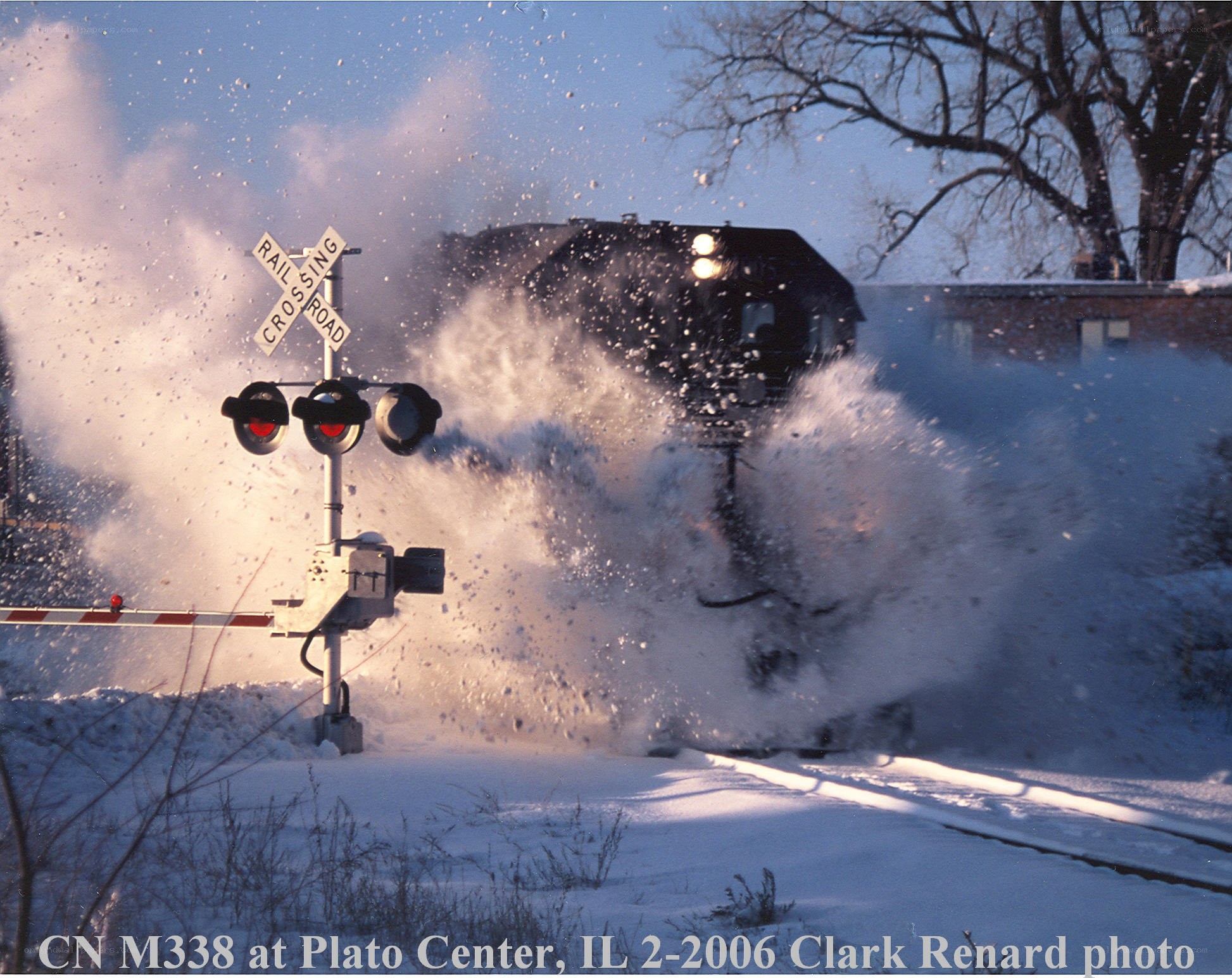 Train plowing through snow