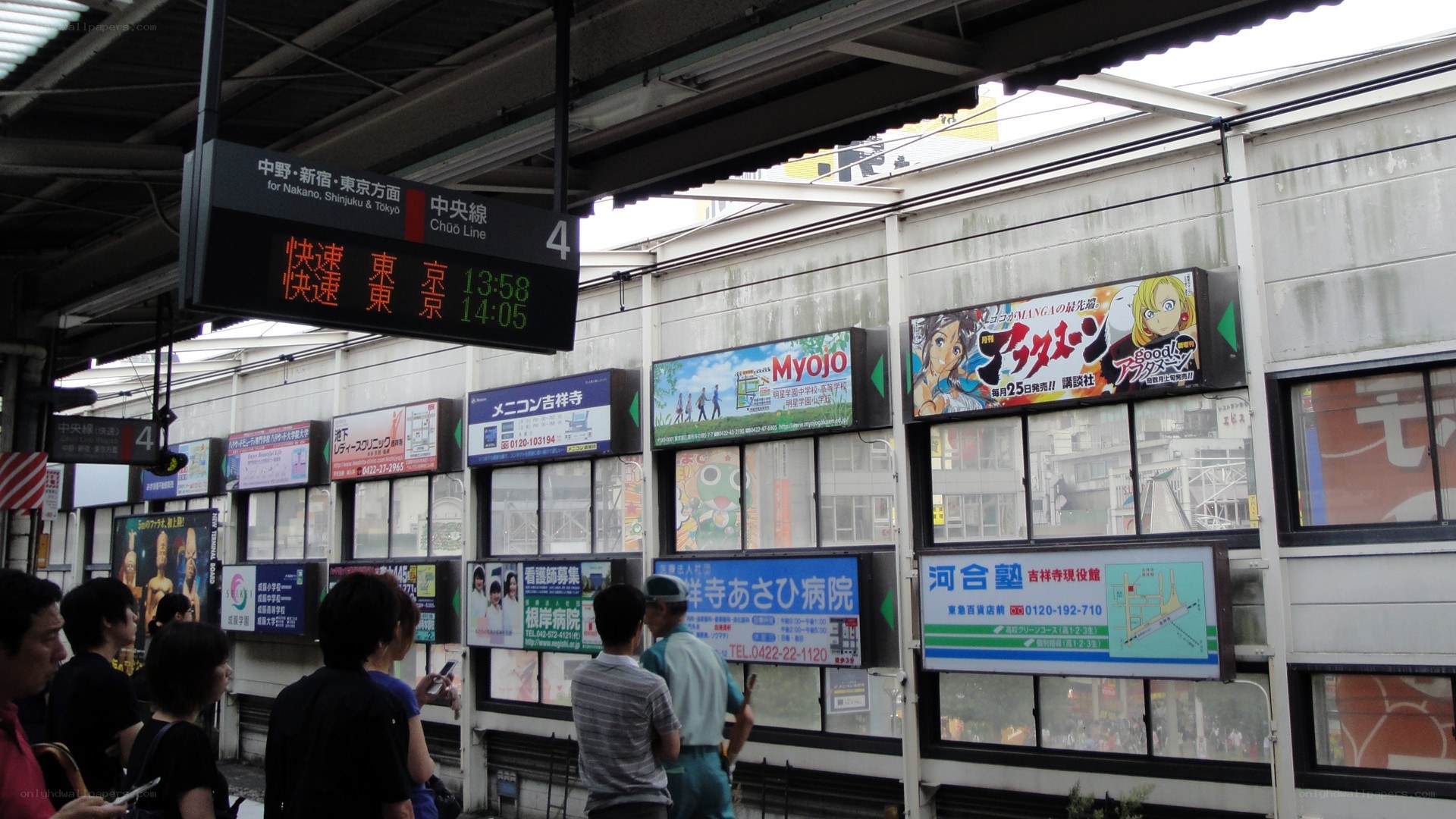 Train station platform with digital sign