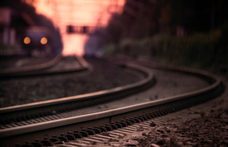 Train Tracks at Dusk — Brown, Dramatic
