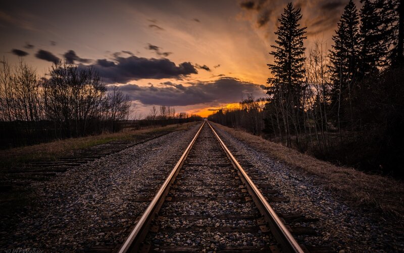 Train Tracks at Sunset — Orange, Dramatic, Photograph, Sky, Trees, Gravel