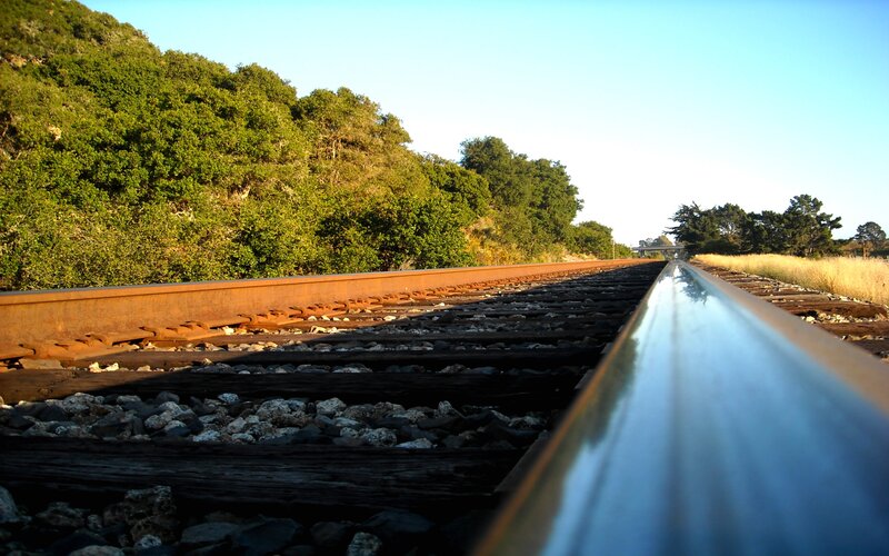 Train Tracks in Forest — Green, Serene, Afternoon, Photograph, Trees, Gravel