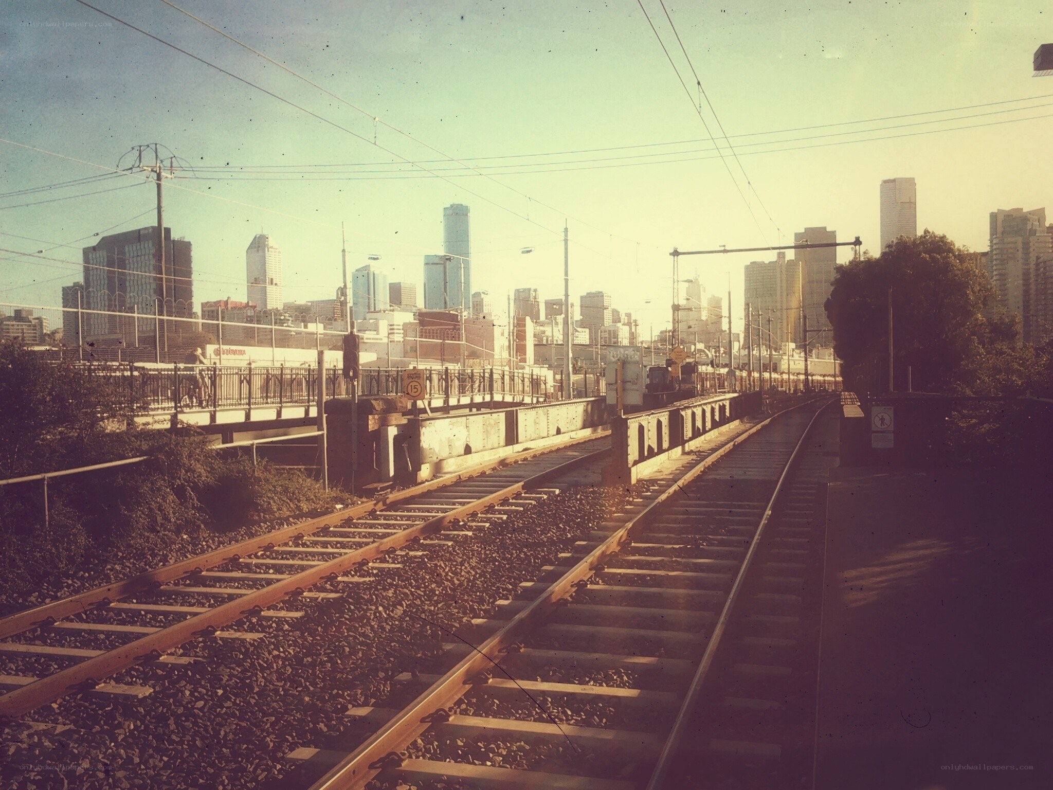 Train tracks leading to city