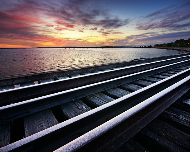 Train Tracks on Pier — Orange