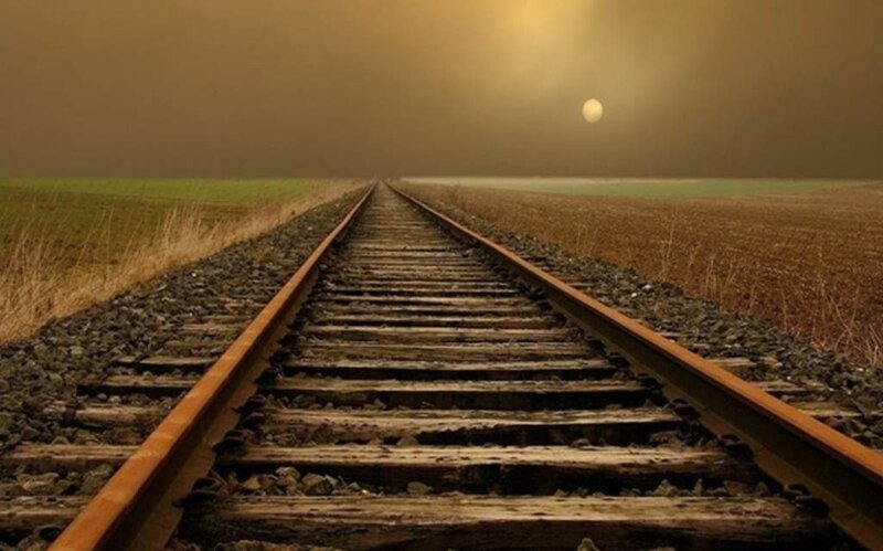 Train tracks stretch into the distance