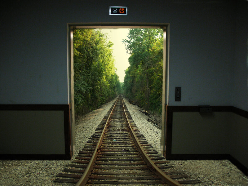Train tracks through a doorway