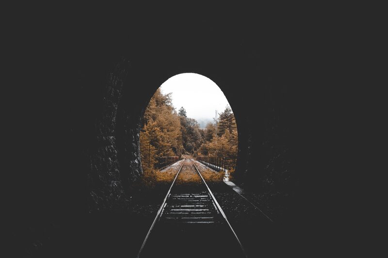 Train tracks through a tunnel