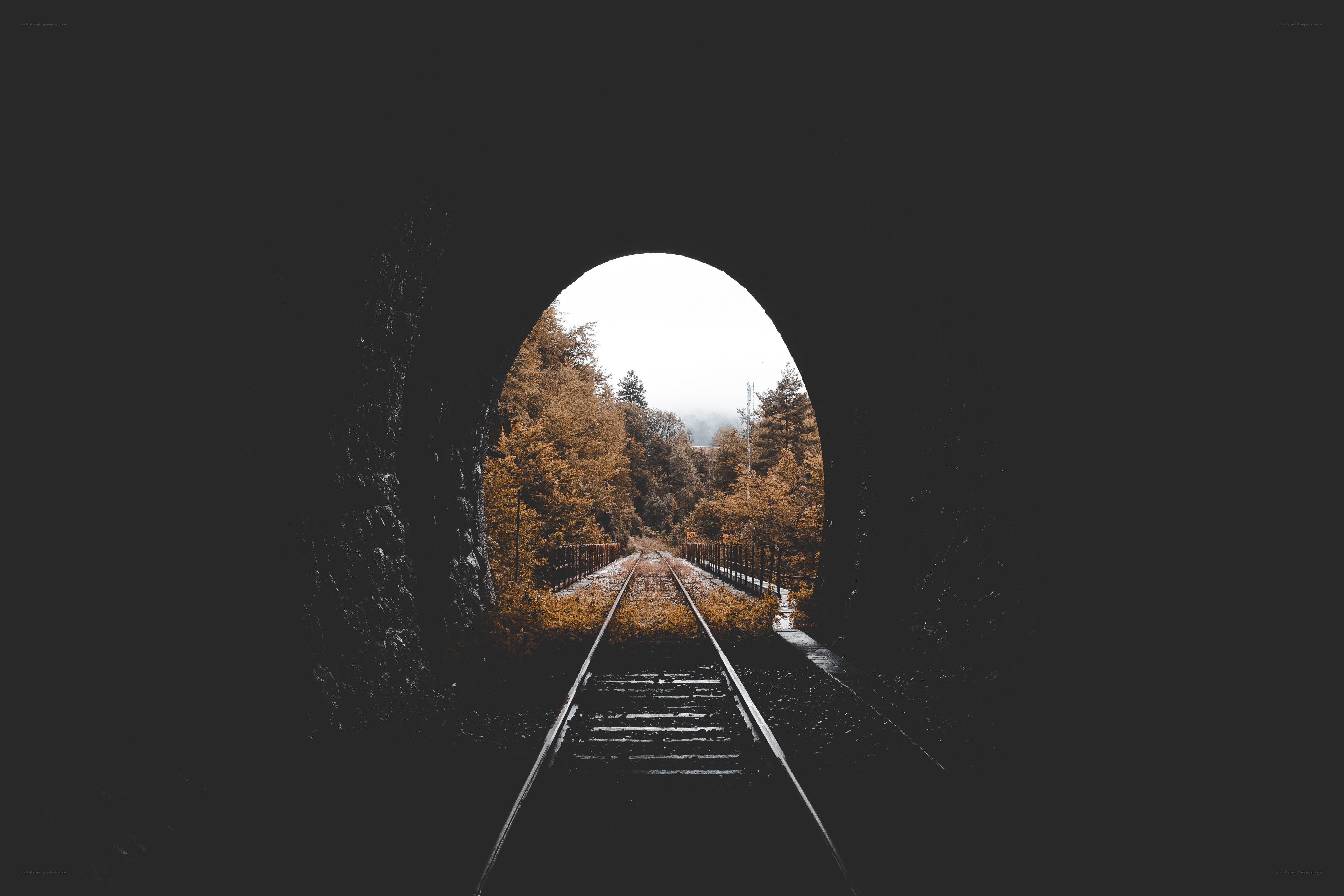 Train tracks through a tunnel