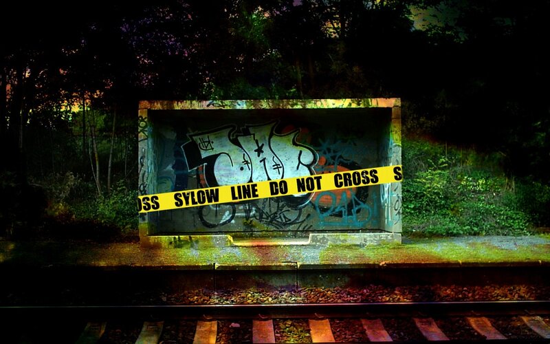 train tracks with caution tape