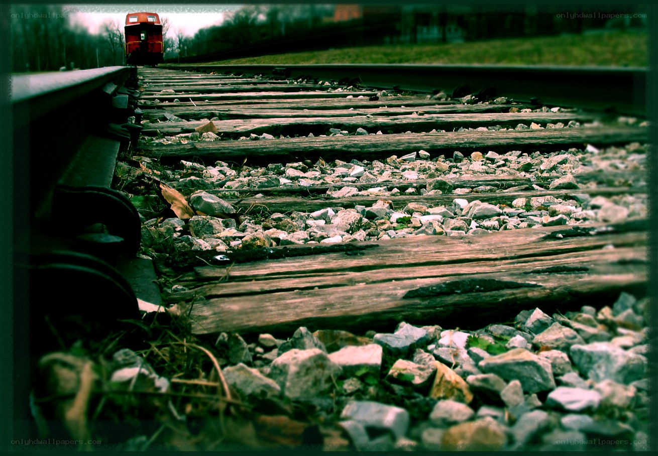 train tracks with red locomotive