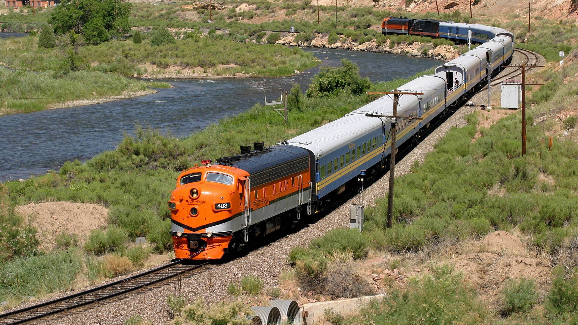 Train traveling along river