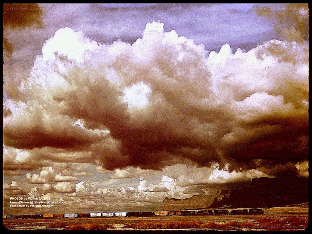 Train under stormy sky