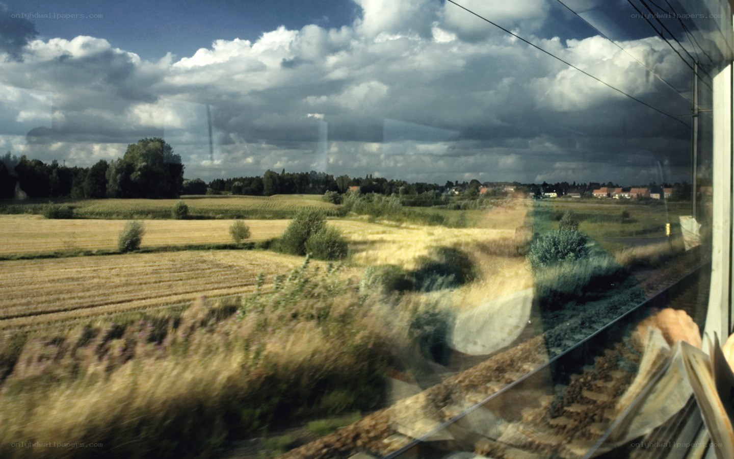 Train window view of countryside