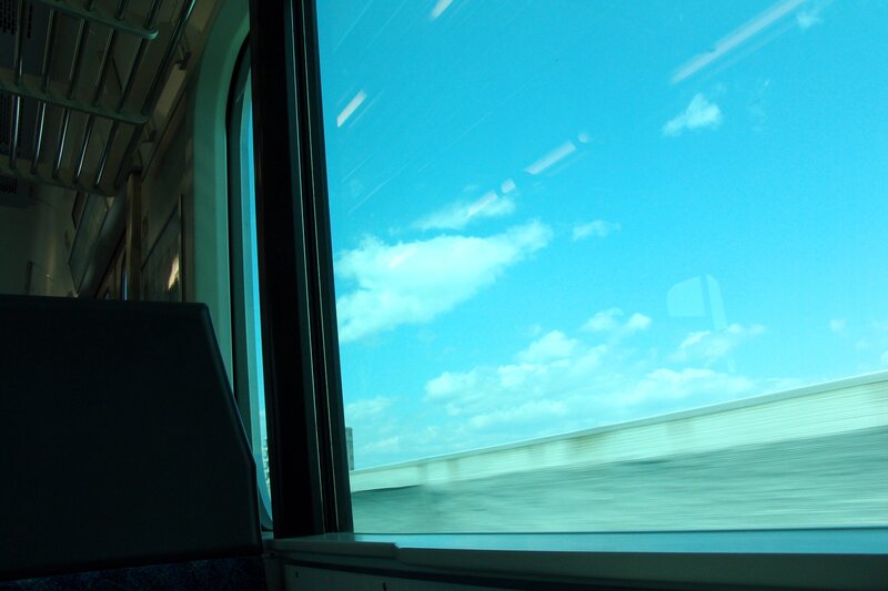 Train window view of sky