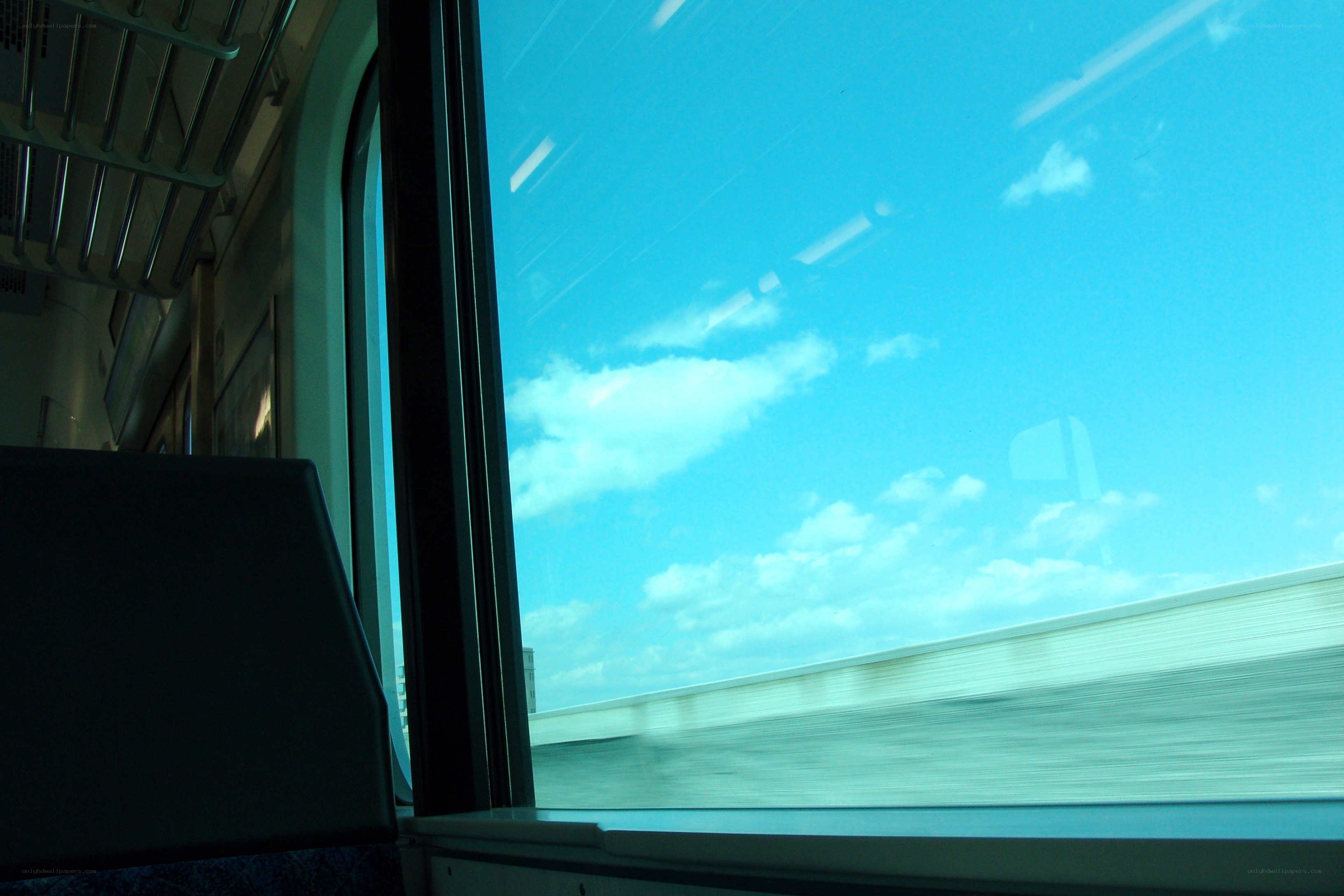 Train window view of sky