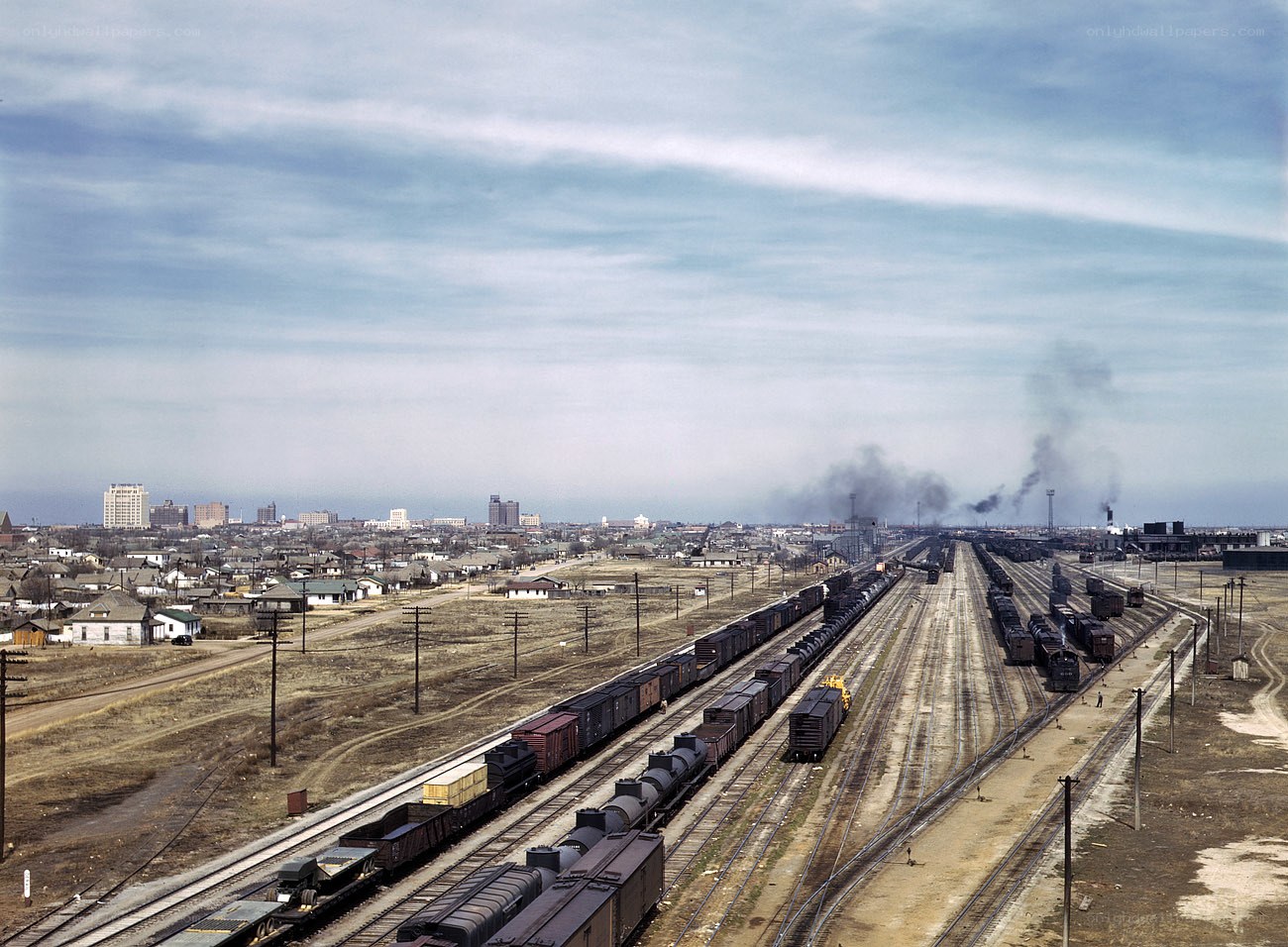 Train yard with city skyline