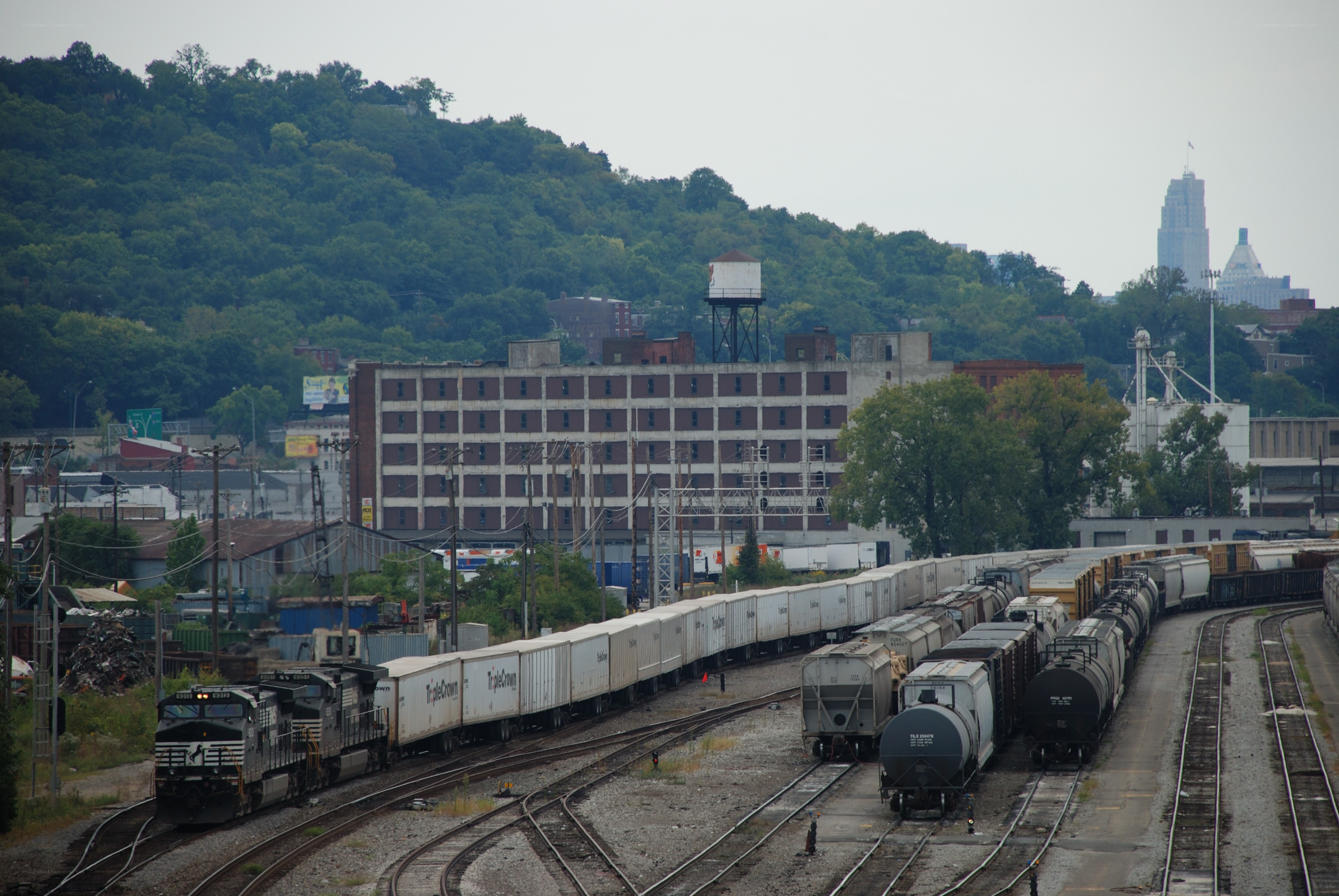 Train yard with city skyline