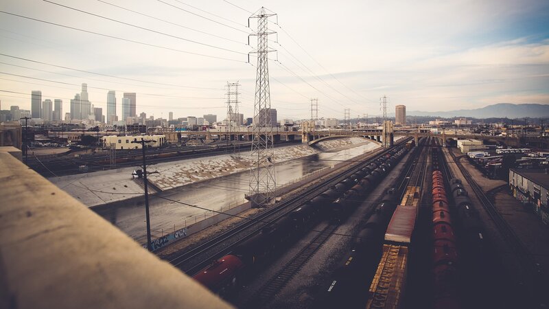 Train Yard with City Skyline — Gray, Industrial