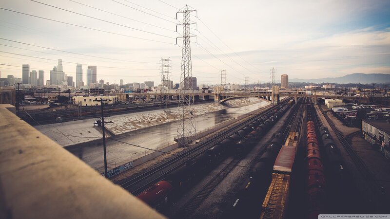 Train Yard with City Skyline — Gray