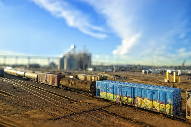 Train yard with graffiti car