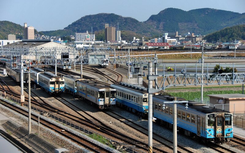 Train yard with multiple blue trains