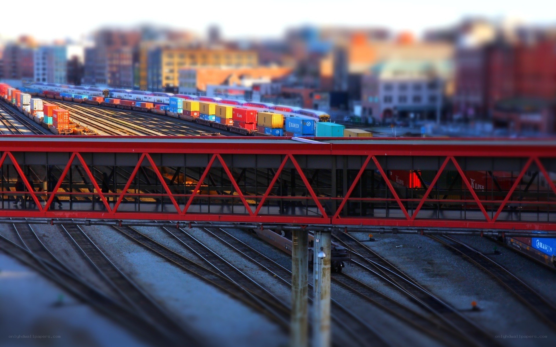 Train yard with red bridge