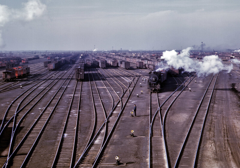 Train yard with steam locomotive