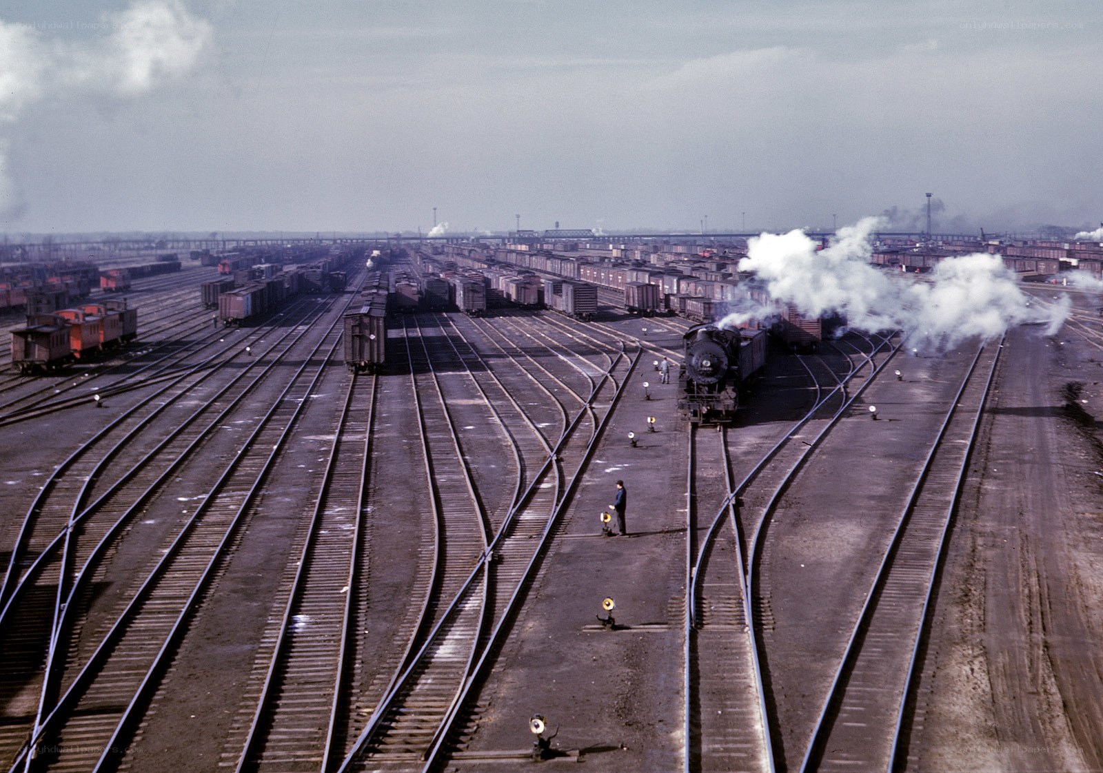 Train yard with steam locomotive
