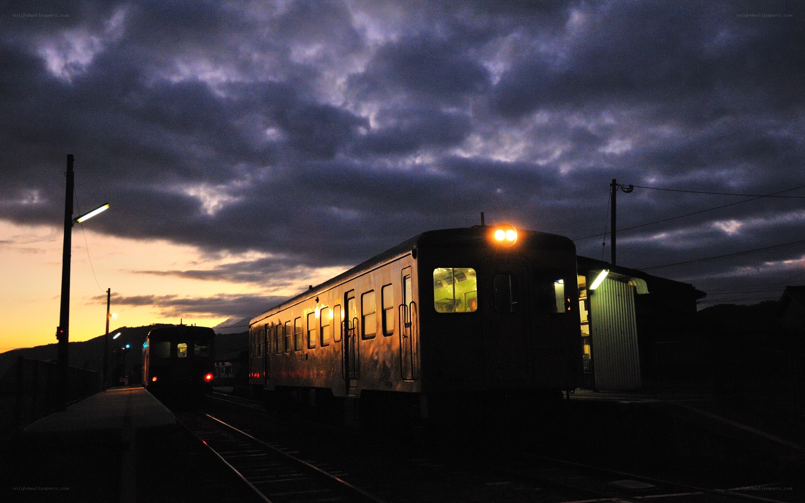 Trains at dusk on a cloudy evening