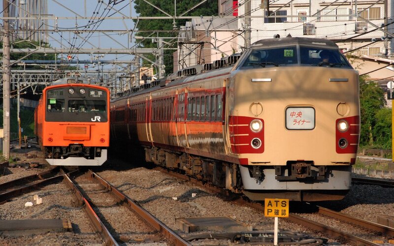 Trains on parallel tracks in Japan