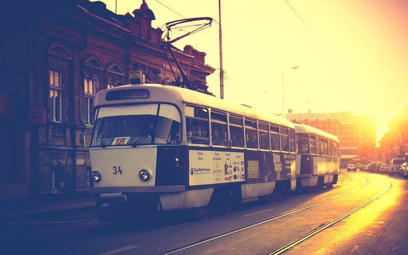 Tram at golden hour in city
