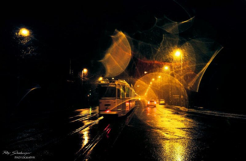 Tram at night in rain